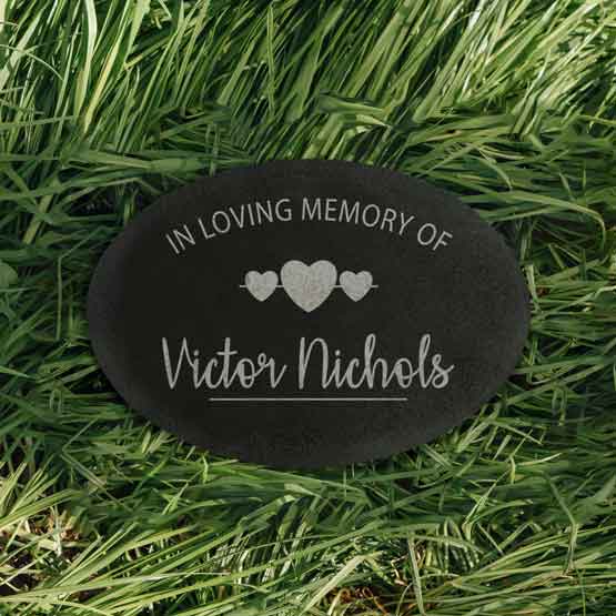 Custom Oval Granite Plaque Laser Engraved With Hearts And In Loving Memory Of Victor Nichols Text Displayed In Grass 