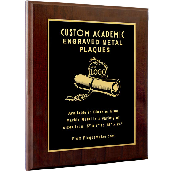 A custom black metal plaque with cherry wood board and gold engraved text, featuring a apple and diploma artwork in the middle, set on a white background.