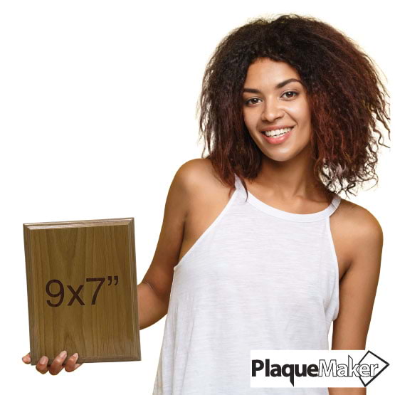 Size Guide With Happy Woman Holding Solid Red Alder Wood Plaque And Showing 9 By 7 Inch Measurement Against White Background