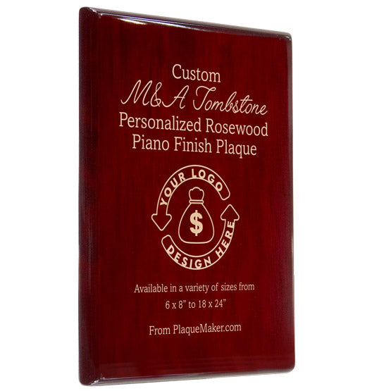 A personalized M&A Tombstone rosewood plaque with beige engraved text and placeholder art, set on a slight angle with a plain white background.