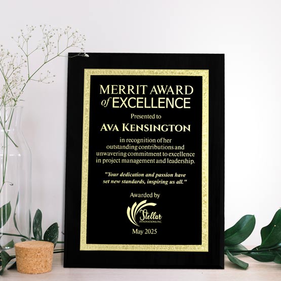 Custom Engraved Plaque With Gold Florentine Border Near Flowers On Table.