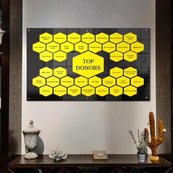47 And A Half By 28 Top Donor Perpetual Plaque With Black Acrylic Board And Yellow Honeycomb Plates On Office Wall Over Shelf