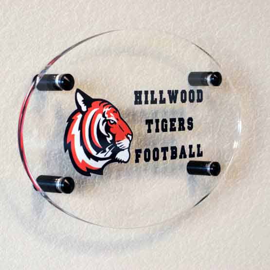 Clear Oval Acrylic Sign Color Printed With Tiger Head Artwork And Hillwood Tigers Football Art Mounted Onto Office Wall 