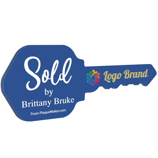 House Key Shaped Blue Acrylic Sign Color Printed With Sold By Message And Sample Logo And Name Against White Background
