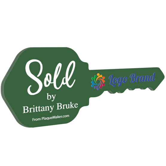 House Key Shaped Green Acrylic Sign Color Printed With Sold By Message And Sample Logo And Name Against White Background