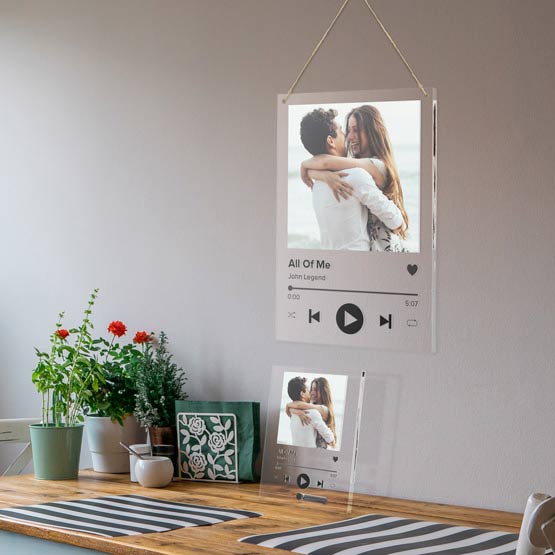 Clear Acrylic Sign With Full Color Couple Photo And Spotify Style Layout With Custom Song Details Hanging Above Dining Table