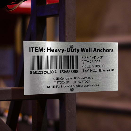 Silver Aluminum Bar Code Tag Printed With Heavy Duty Wall Anchors Details And Barcode Mounted Onto Metal Beam Outdoors