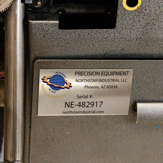 Silver Aluminum Serial Number Tag Printed With Company Logo And Product Details And Serial Number Mounted Onto Metal Panel