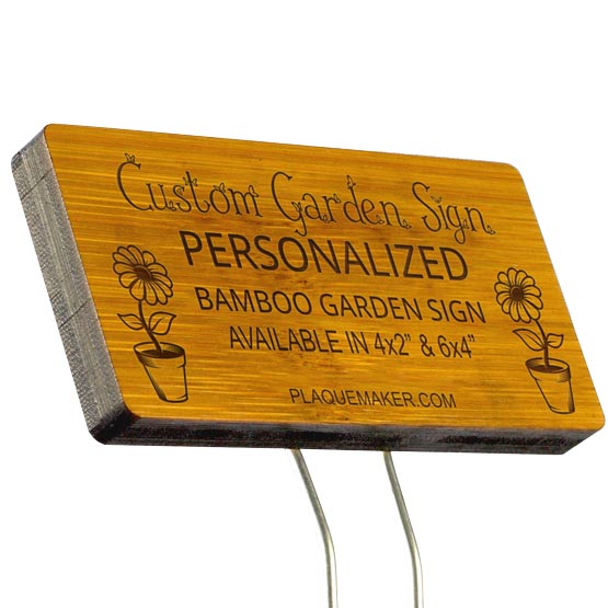 A bamboo garden sign with rounded corners on a metal stake set on a white background, featuring sample engraved text and a placeholder artwork.