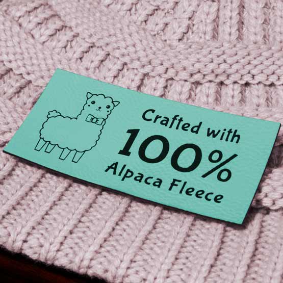Teal And Black Faux Leather Label Engraved With Alpaca Art And Crafted With One Hundred Percent Alpaca Fleece Text On Hat