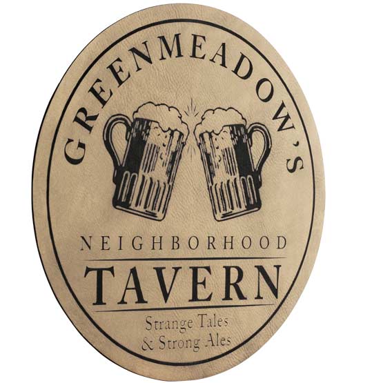 Light Brown And Black Faux Leather Sign Laser Engraved With Greenmeadows Tavern Logo And Slogan Against White Background