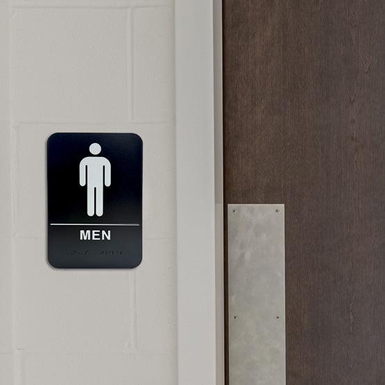 Black And White Plastic Sign With Rounded Corners And Men Icon And Text And Braille Mounted On Wall Beside Door
