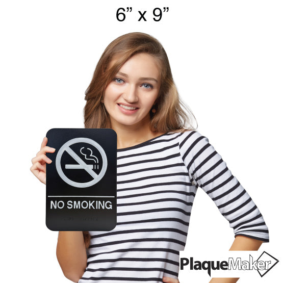 Size Guide Of Woman Holding 6 By 9 Black And White Plastic Sign With No Smoking Icon And Text And Braille