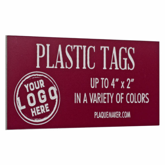 Custom Red Plastic Label Laser Engraved To Show Customization Options And Areas For Text And Art Against White Background