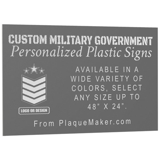 A custom gray plastic sign with personalized engraved text and placeholder artwork, set at a slight angle and displayed on a white background.