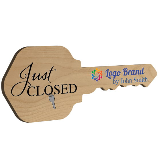 House Key Shaped Red Alder Wood Sign Color Printed With Just Closed Message And Sample Name And Logo Against White Background