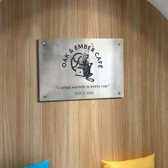 Stainless Steel Sign Laser Fused With Custom Cafe Logo And Details Mounted Onto Wood Paneled Wall Via 4 Silver Standoffs