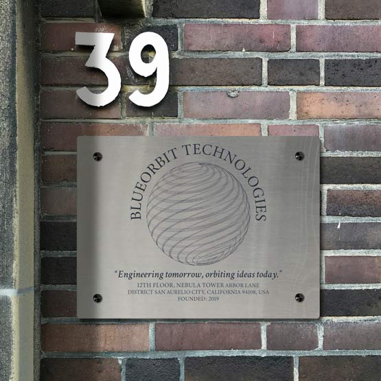 Stainless Steel Sign Laser Fused With Tech Company Logo And Details Mounted On Brick Wall Via Black Standoffs
