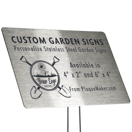 A stainless steel garden sign set on a white background, featuring customizable engraved text and placeholder artwork, mounted on garden stake.