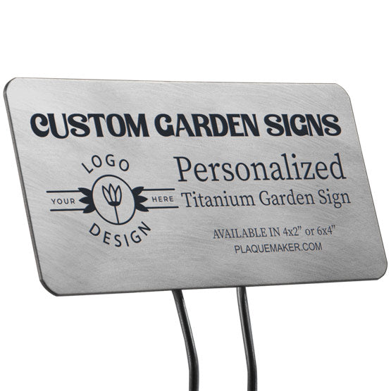 A titanium garden sign with rounded corners on a metal stake set on a white background, featuring sample engraved text and a placeholder artwork.