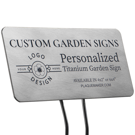 A titanium garden sign with rounded corners on a metal stake set on a white background, featuring sample engraved text and a placeholder artwork.