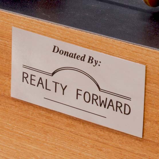 Custom Titanium Label Laser Fused With Donated By Message And Realty Forward Business Logo And Mounted On Wood Panel