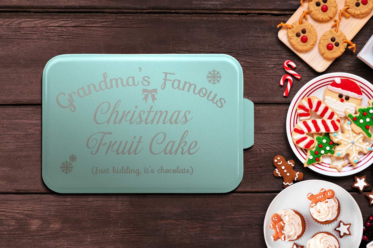 Custom designed teal cake pan with a cute Christmas gift design