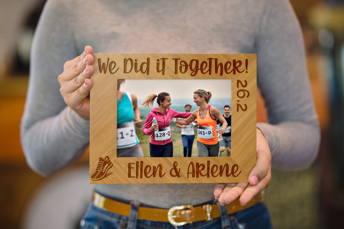 Woman holding custom engraved marathon picture frame