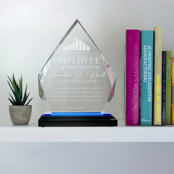 Fully customizable diamond acrylic award on a blue mirrored base, sitting on a shelf to display an achievement or award.
