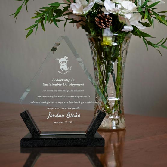 Custom Diamond Award sitting on a table displaying an achievement that is Laser Engraved on the glass with a custom design