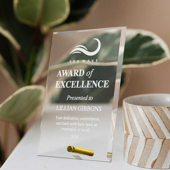 Custom Engraved Rectangle Economy Glass Award with your Text and Logo on Table next to Coffee Mug
