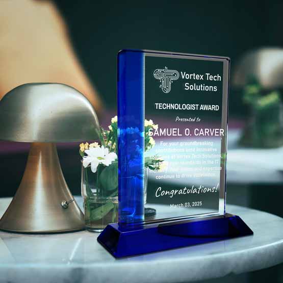 Custom Engraved Glass Award With Blue Edge On Table Near Mushroom Lamp