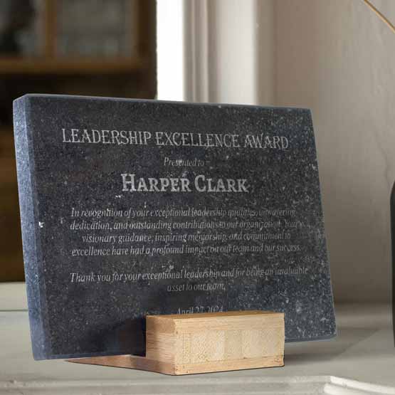 Custom Engraved Granite Award on Table near Flowers