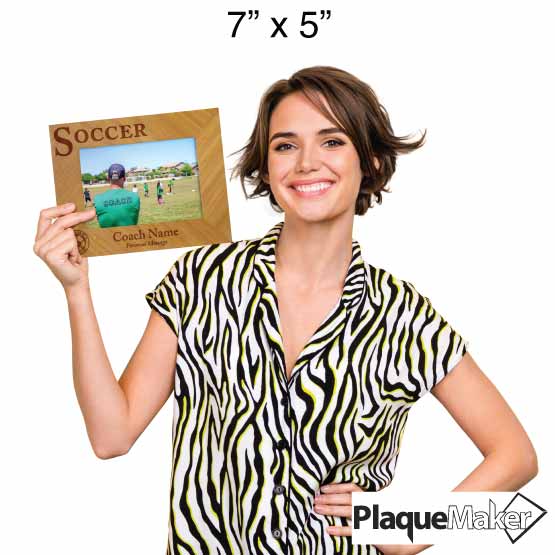 Personalized Engraved Sports Bamboo Picture Frame held by a Woman to show it's size and holds a 5" x 7" Landscape Photo