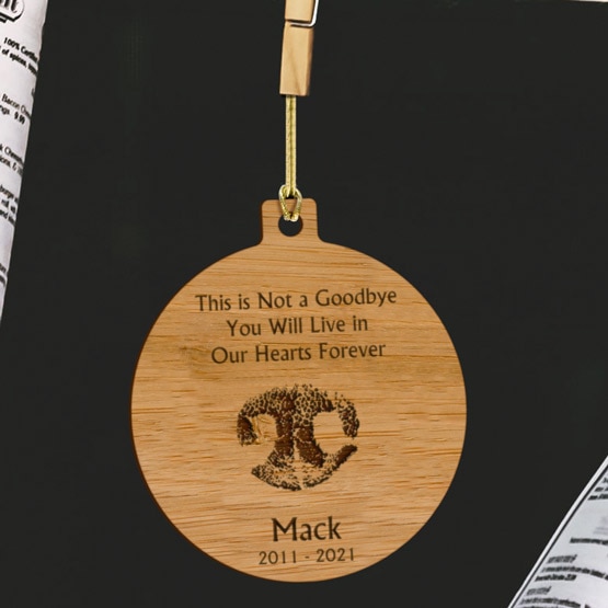 Personalized Dog Nose Print Bamboo Ornament crafted from eco-friendly bamboo, hanging by a clothes pin and golden string