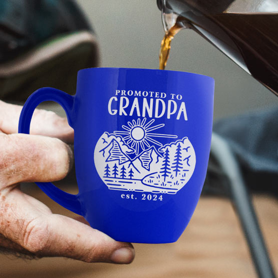 Custom Engraved 16 oz Blue Ceramic Mug held by elderly man with sample engraving for Grandpa