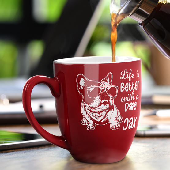 16 oz Custom Red Bistro Coffee Mug Engraved with a Dog named Jax on Table near Laptop.