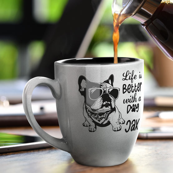 16 oz Custom Silver Bistro Coffee Mug Engraved with a Dog named Jax on Table near Laptop.