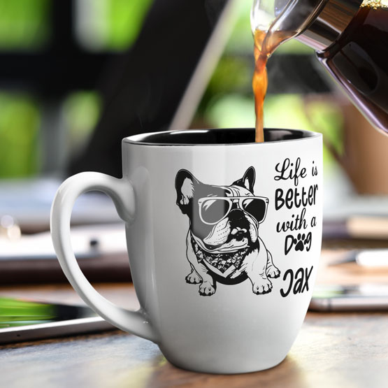 16 oz Custom White Bistro Coffee Mug Engraved with a Dog named Jax on Table near Laptop.