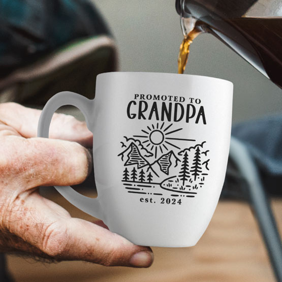 Custom Engraved 16 oz White Ceramic Mug held by elderly man with sample engraving for Grandpa