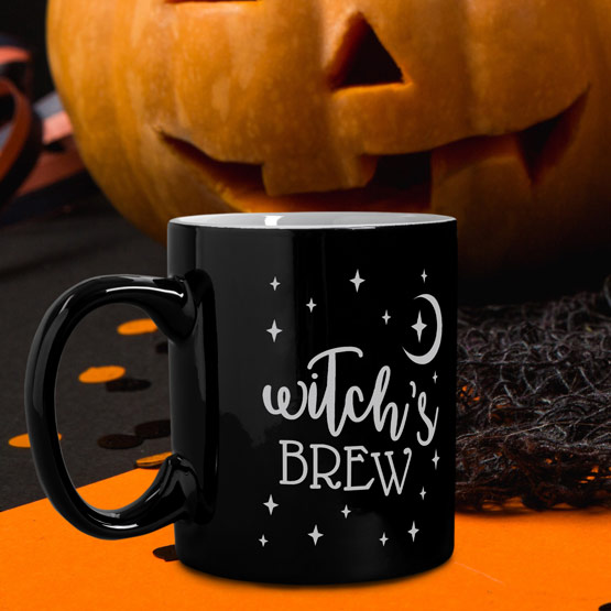 Black Witch's Brew Mug by a Pumpkin