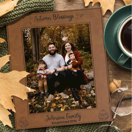 Custom Engraved Faux Leather Rawhide Picture Frame On Table With Leaves