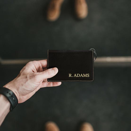 Black with Gold Wallet in Hand