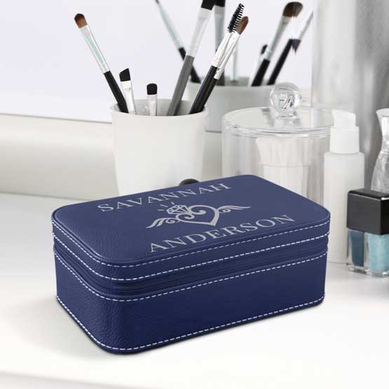 Blue Faux Leather Jewelry Box With Silver Stitching And Custom Names And Art On White Dresser With Makeup Brushes