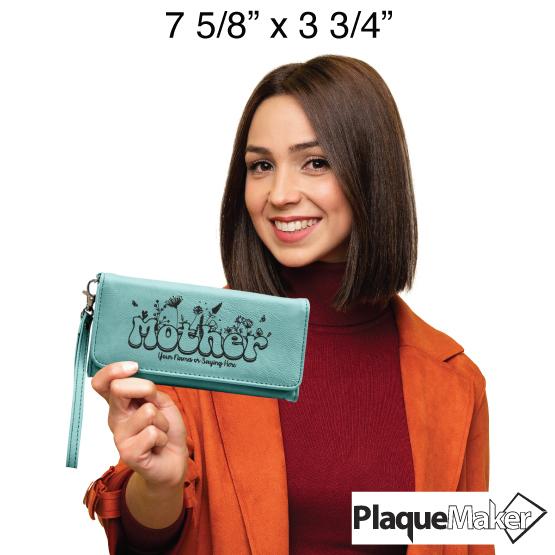 Custom Teal Wrist Wallet with Mother Engraved on it Size Guide. Woman is holding the wallet to demonstrate the 7 5/8x3 3/4" size.