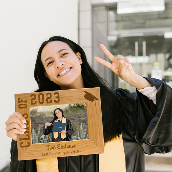 Grad holding a Custom Picture Frame