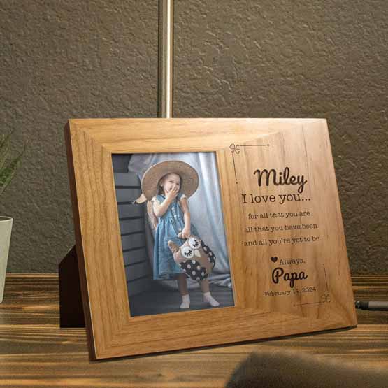 Custom I Love You Red Alder Picture Frame from a father to child on bedside table.