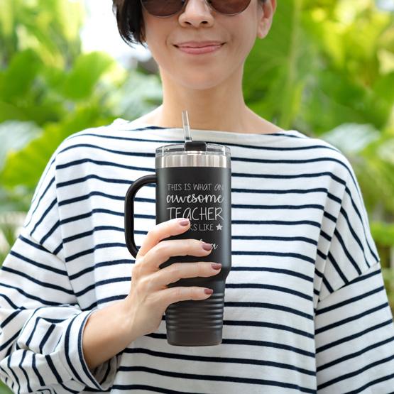 Custom Engraved 40 oz Black Tumbler with Handle Held by Teacher in Sunglasses