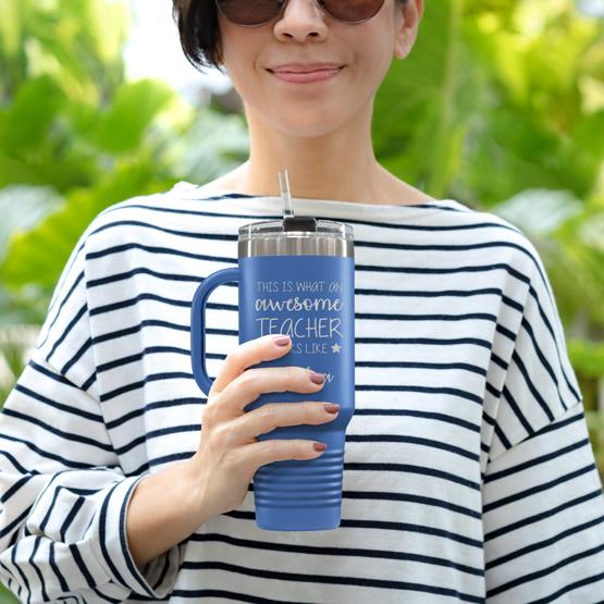 Custom Engraved 40 oz Blue Tumbler with Handle Held by Teacher in Sunglasses