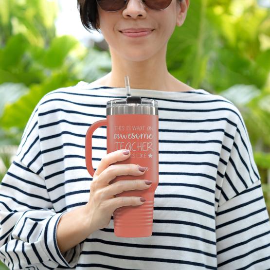 Custom Engraved 40 oz Coral Tumbler with Handle Held by Teacher in Sunglasses